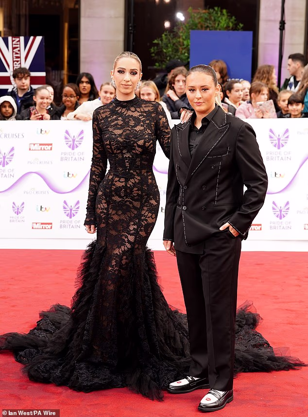 GK arrived on the arm of her footballer girlfriend Ella Rutherford