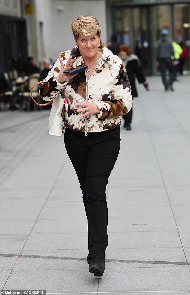 She cut a trendy figure in a cow-print jacket and black jeans